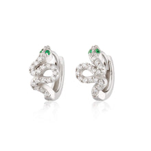 Load image into Gallery viewer, Silver sparkling snake huggie earrings with green eyes.