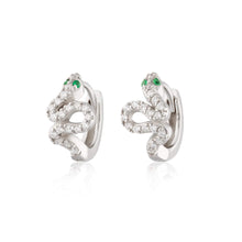 Load image into Gallery viewer, Silver sparkling snake huggie earrings with green eyes.

